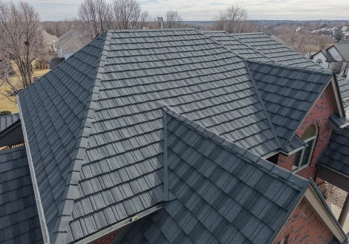 Modern home with a sleek, durable gray shingle roof in a suburban neighborhood.