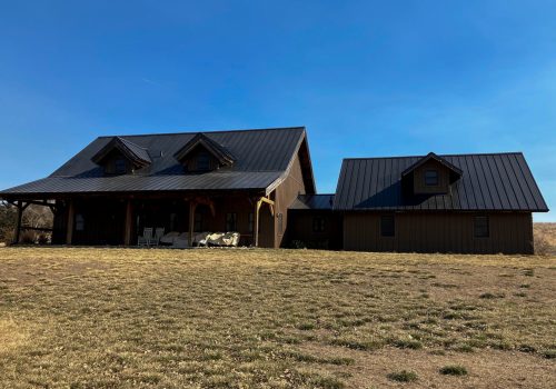 Experienced roofing contractors installing a metal roof in Omaha, NE